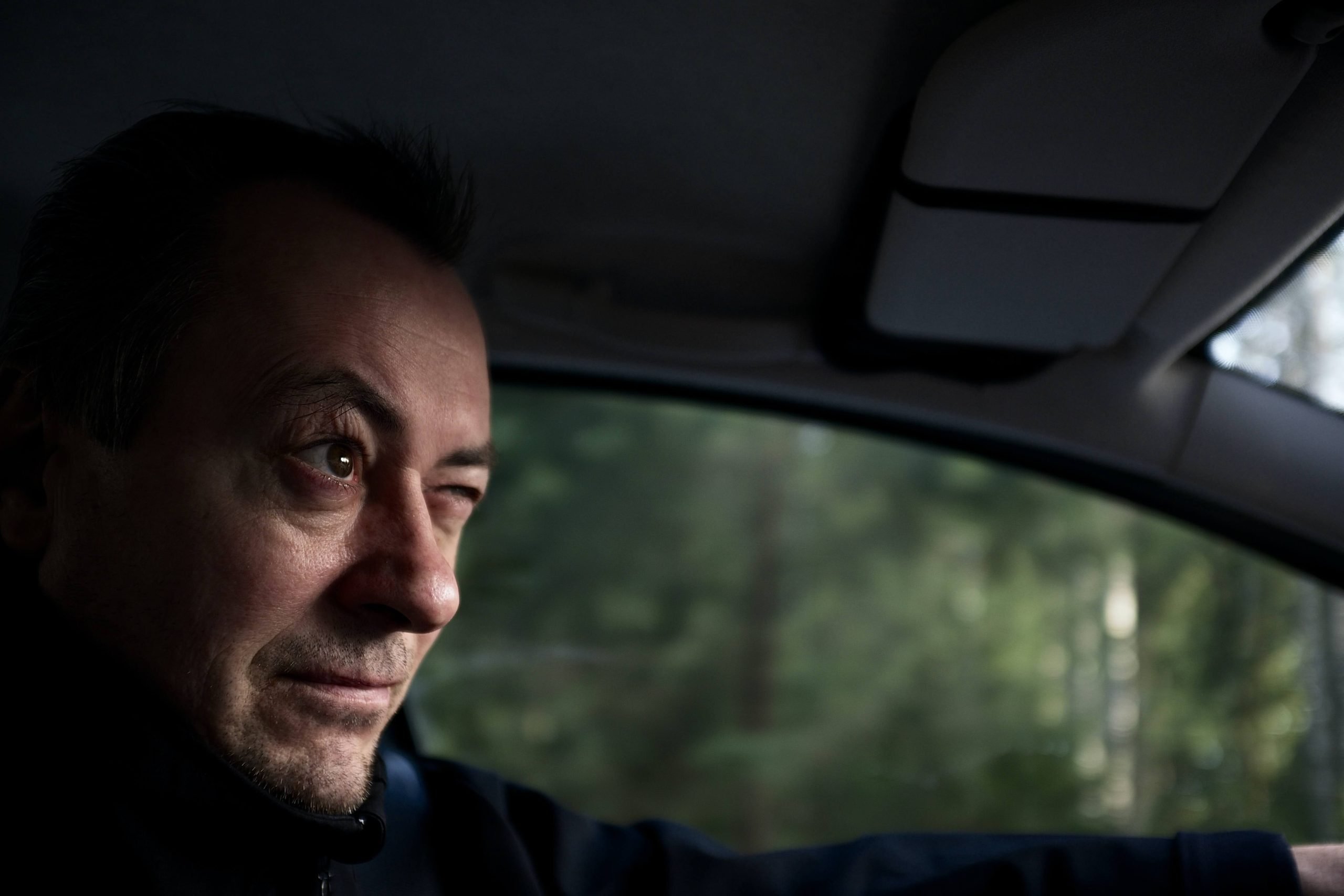 Man with unease face expression in a car – photo by Miikka Luotio on Unsplash Man wondering how to dispute IRP in B.C. Canada